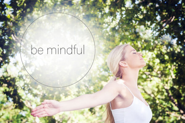 Motivational new years message against attractive blonde woman practicing yoga in a park