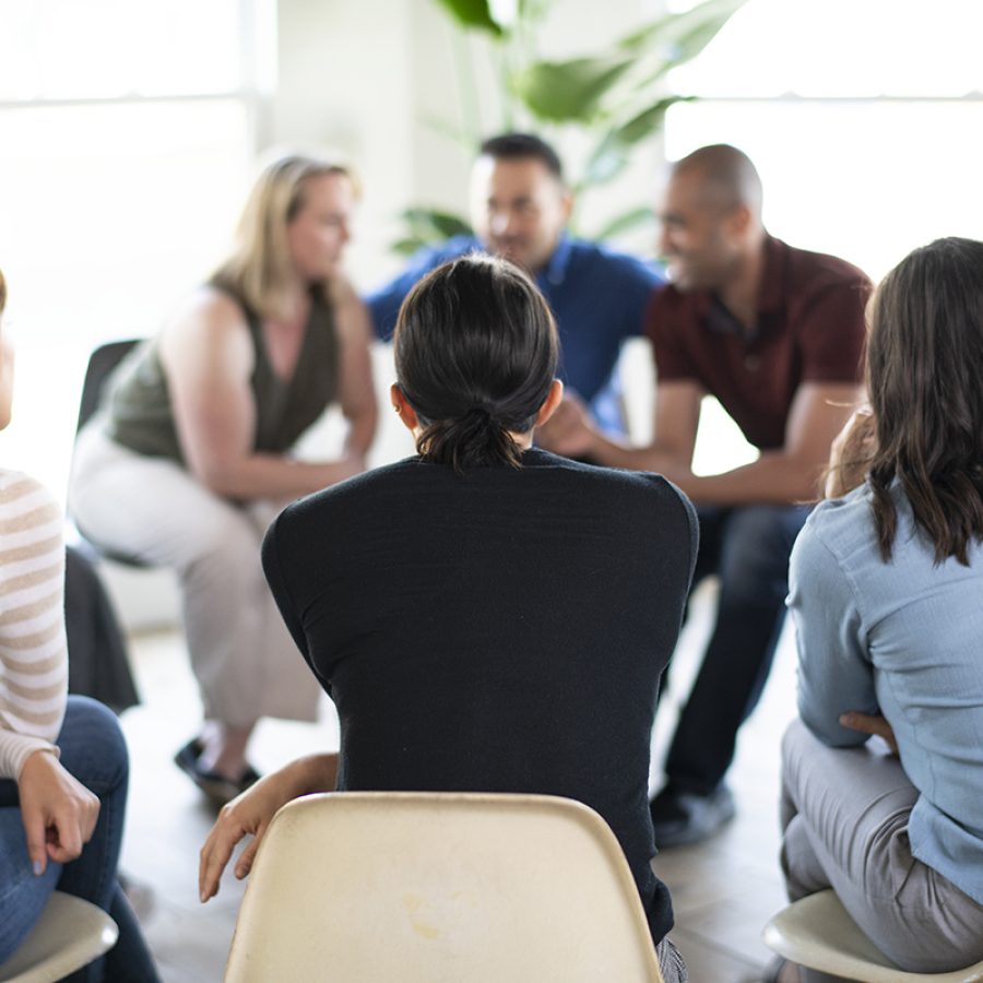 Diverse people in a supporting group session